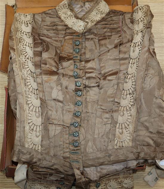 A Victorian satin and lace ladys blouse in a leather case